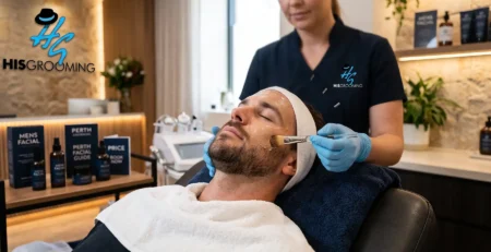 Men's facial treatment at HisGrooming Perth clinic, therapist applying mask to male client