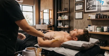 Therapist applying warm wax to a man’s underarm during a mens waxing Claremont appointment at His Grooming